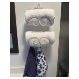 Metal shelf with bath towels