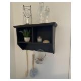 Hanging wooden shelf with decor