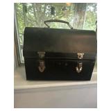 Vintage metal lunchbox full of flower seeds