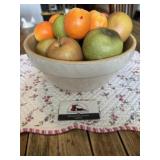 Stoneware bowl and fake fruit