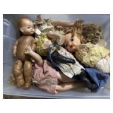 Tote of vintage dolls