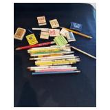Advertising pencils and matchbooks