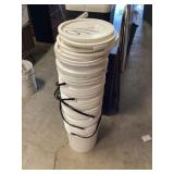 Seven empty 5 gallon buckets with lids