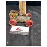 Pressed metal friction toy