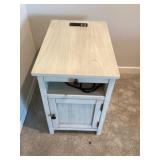 Side table with outlet