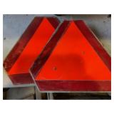 Slow moving vehicle signs