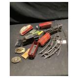 Pressed metal vehicles, and belt buckles