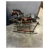 Child, rocking horse