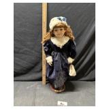 Porcelain doll approximately 29 inches tall