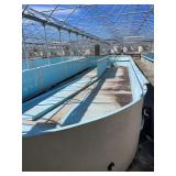 Used oval fiberglass aquaculture tank. Approximately 55’x16’x4’. Comes with two tank filtration system and center partition.