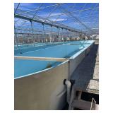 Used oval fiberglass aquaculture tank. Approximately 55’x16’x4’. Comes with two tank filtration system and center partition.