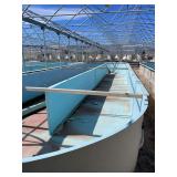 Used oval fiberglass aquaculture tank. Approximately 55’x16’x4’. Comes with two tank filtration system and center partition.