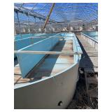 Used oval fiberglass aquaculture tank. Approximately 55’x16’x4’. Comes with two tank filtration system and center partition.