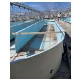 Used oval fiberglass aquaculture tank. Approximately 55’x16’x4’. Comes with two tank filtration system and center partition.