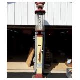 Wayne clear glass hand operated gas pump.  Brass
