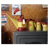 (4) Shell oil cans in various sizes.