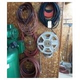 Lot of electric chord and air hose.
