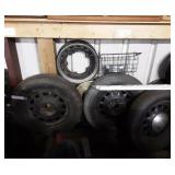 Rims & Tires along wall.