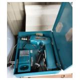 Makita drill motor in case.