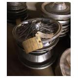 (4) stacks of hubcaps.