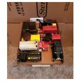Tray of toy trucks.