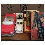 Tray of cars and BB guns.