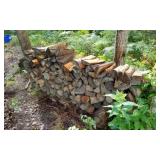 SEASONED STACK OF SPLIT FIREWOOD