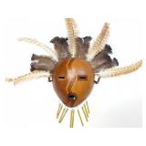 WOODEN TRIBAL MASK WITH FEATHERS AND CHIMES-