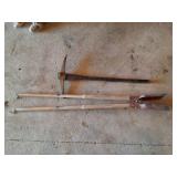 POST HOLE DIGGER AND A PICK WITH WOODEN HANDLE