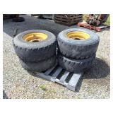 SKID LOADER WHEELS-  4 RIMS WITH TIRES