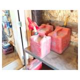 3 RED GAS CANS AND FUNNEL