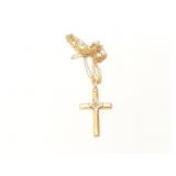 1.9g 14k broken yellow gold chain with cross;