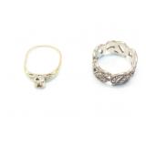 1.6g 14k yg bent ring with center stone missing;