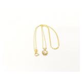 2.6g 14k yg thin chain with heart charm and clear