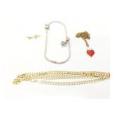 1.3g 14k yg/wg links from bracelet; 20.1g .925