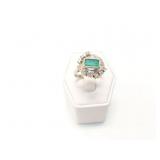 6.9g platinum ring with diamond chips and 1 green