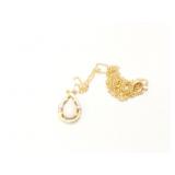 1.7g 14k yg thin chain with pendant that has 1
