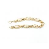 16.2g 14k yg bracelet with several white beads;