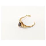 2.8g 14k broken ring with black center stone;