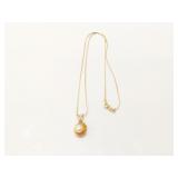 2.3g 14k yg thin chain with pendant that has 1