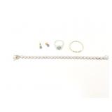 1.5g 14k yg pr earrings with 1 light blue stone