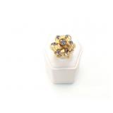 14g 14k yg ring with blue chips on top;