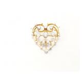 8.2g 18k yg heart pin with several small euro cut