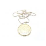 51g 22k yg chain with attached large pendant;