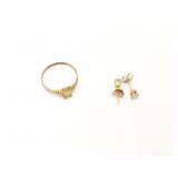 1.4g 10k yg ring with yellow center stone; .7g