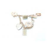 gold toned charm bracelet with 7 charms (2-gold
