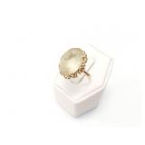 3.6g 10k yg ring with large white,clear stone;