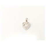 1.8g 14k wg heart charm with several clear chips;