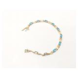 7g 10k yg bracelet with blue stones;