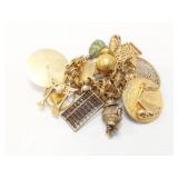 Approx. 138g 14k yg charm bracelet with 12 gold
